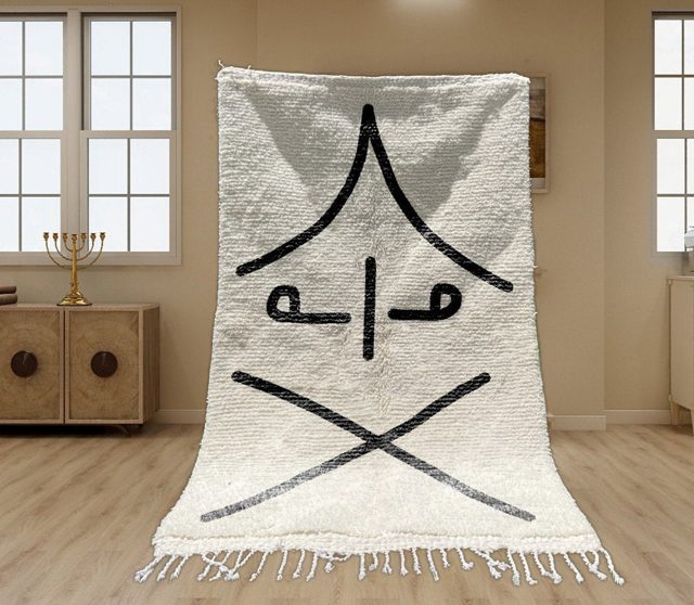 Handwoven Moroccan Rug with Traditional Symbol